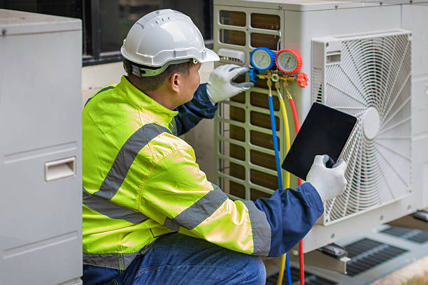 Professional Heat Pump Repair technician working in Hathorne, MA
